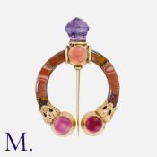 A Victorian Scottish Penannular Brooch / Pin in yellow gold, set with various polished hardstones,