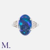 A Black Opal And Diamond Ring in white gold, Set with a principal cabochon black opal of