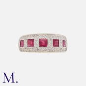 A Ruby And Diamond Ring in 18k yellow gold, set with five square synthetic rubies, accented by round