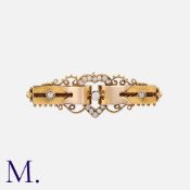 A Diamond Brooch in yellow gold, of ribbon and heart design, set with old cut diamonds, accented