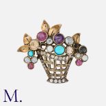 A Giardiniere Brooch in yellow and white metal set with various gemstones. Size: 3.4x4.0cm Weight: