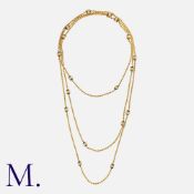 An Enamel Longuard Rope Chain in yellow gold, comprising a series of interlocking rope links,