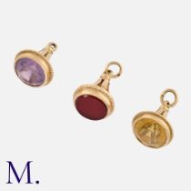 A Set of Three Gemstone Fob Seals in 9K yellow gold, one set with amethyst, one with citrine and one