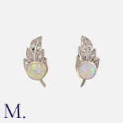 A Pair Of Opal And Diamond Earrings in white gold, of leaf design, set with a cabochon opal,
