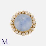 A Sapphire and Diamond Ring in 18K yellow gold, set with a cabochon blue sapphire weighing approx.