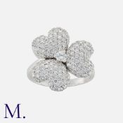 MOUAWAD, A 'Flower Of Eternity' Ring in 18k white gold, designed as a flower, set with round cut