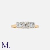 A Vintage Old Cut Diamond Three Stone Ring in 18k yellow gold and platinum, set with three old cut