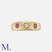 A Ruby and Diamond Gypsy Ring in 15K yellow gold, set with an old cut diamond to the centre with