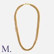 A Multi-strand Chain Necklace in 18k yellow gold, comprising ten lengths of fine trace chain,