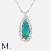 A Black Opal And Diamond Pendant Necklace in 18k white gold, set with a principal black opal of