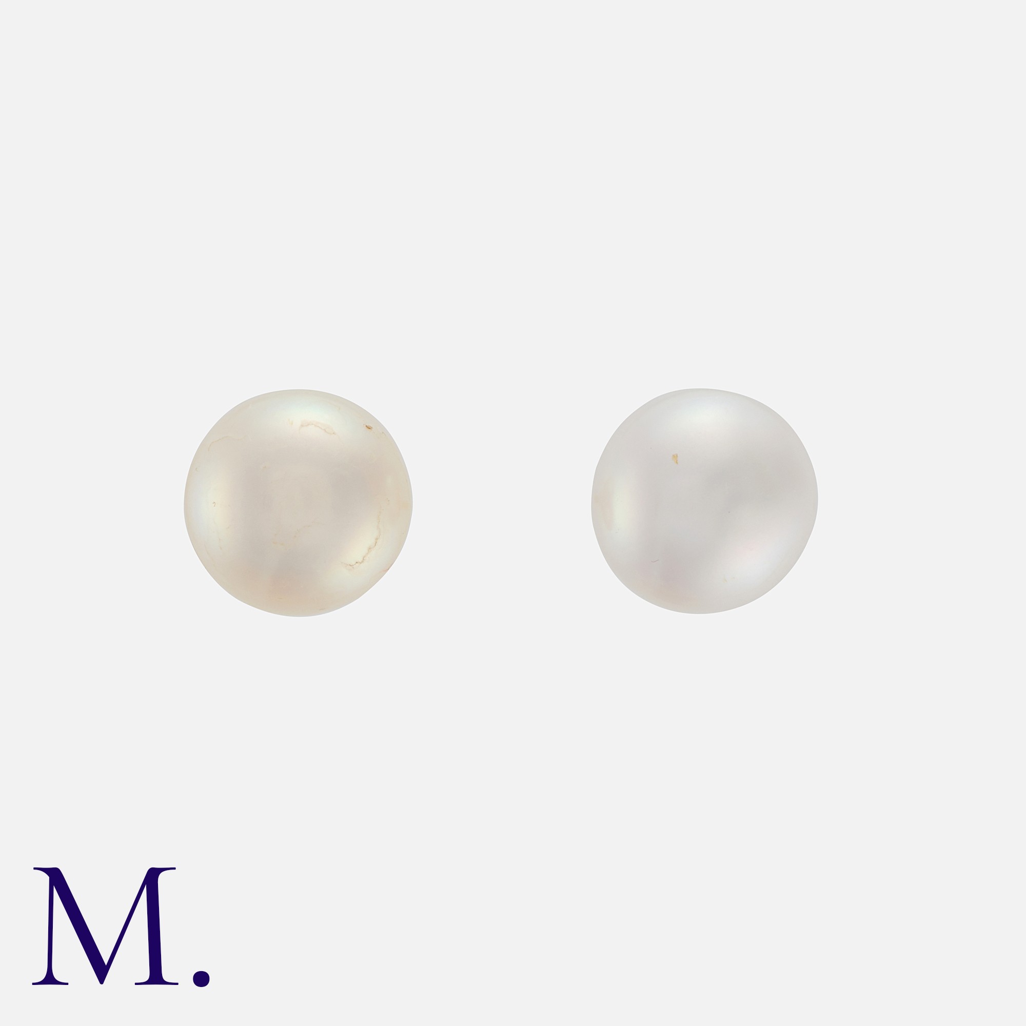 A Pair Of Pearl Stud Earrings in yellow gold, each compressing a pearl of approximately 6.2mm, to