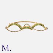 A Demantoid Garnet And Diamond Brooch in yellow and white gold, of abstract design, set throughout