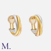 CARTIER. A Pair of Trinity Earrings in 18K yellow, white and rose gold. Signed Cartier and serial
