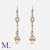 A Pair Of Pearl And Diamond Earrings in yellow gold, each comprising a series of articulated