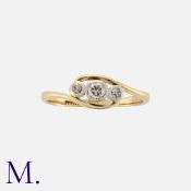 A Diamond 3-Stone Twist Ring in yellow gold set with three round cut diamonds to a twisted band.