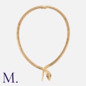 A Tubogaz Snake Collar in 9K yellow gold, the tubogaz collar form terminating in an engraved snake