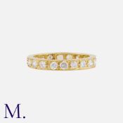 A Diamond Eternity Ring in yellow gold, set throughout with round cut diamonds totalling