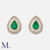 A Pair of Emerald and Diamond Cluster Earrings in 18K yellow gold, set with pear cut emeralds each