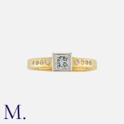 A Diamond Solitaire Ring in 18K yellow and white gold, set with a princess cut diamond weighing 0.