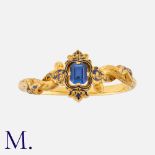 An Antique Synthetic Sapphire And Enamel Bangle in 18k yellow gold. Of scrolling and foliate design,