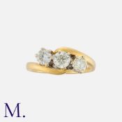 A 3-Stone Diamond Twist Ring in 18K yellow gold, set with three round cut diamonds weighing