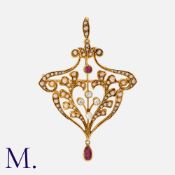 A Ruby, Pearl And Diamond Brooch Pendant in 15k yellow gold, of scrolling foliate design, set