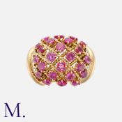 LACLOCHE. A Ruby and Diamond Retro Ring in 18K yellow gold, set with 24 round cut rubies (likely
