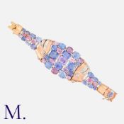 A Ceylon No Heat Sapphire And Diamond Bracelet in rose gold, set with an array of pink and blue
