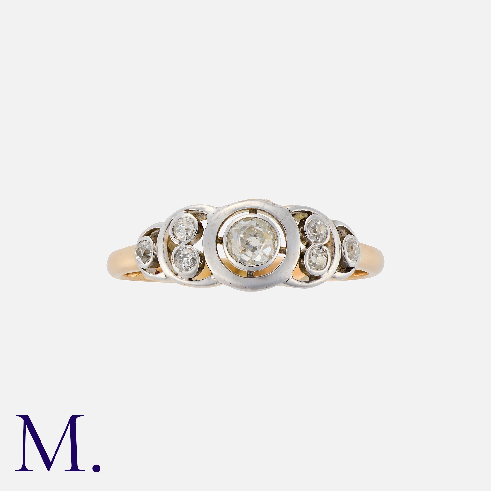 A Vintage Diamond Ring in 18k yellow gold and platinum, set with seven round cut diamonds, the