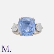 A 10.54 Carat Sapphire And Diamond Three Stone Ring in 18k white gold. Set with a principal