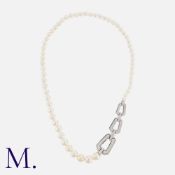 CARTIER. A Chandra Pearl and Diamond Collar in 18K white gold with a single row of graduating pearls