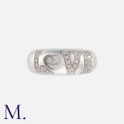 CHOPARD. A Happy Diamonds Love Ring in 18K white gold with diamond-set 'LOVE' motif and floating