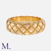 A French Gold Retro Bangle in 18K yellow gold with pillow and rope-work design. Maker's mark in