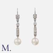 A Pair of Diamond and Pearl Drop Earrings, each designed as a series of articulated links, set