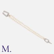 CARTIER. A Chandra Pearl and Diamond Bracelet in 18K white gold with two rows of pearls