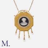 A Cameo Pendant Necklace in 15k yellow gold, set with an octagonal cameo, accented by five pearl set
