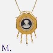 A Cameo Pendant Necklace in 15k yellow gold, set with an octagonal cameo, accented by five pearl set