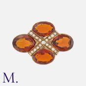 A Citrine And Pearl Brooch in yellow gold, set with four oval cut madeira citrine, accented by a