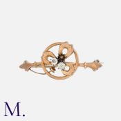 A Shamrock Brooch in rose gold set with paste stones (one missing). Unmarked; tests indicate 9ct