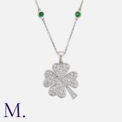 A Diamond And Green Garnet Necklace in white gold, comprising a four leaf clover pendant set with