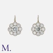 A Pair Of Diamond Cluster Earrings in 18k white gold each set with a central old European cut