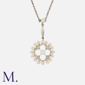 A Pearl And Diamond Pendant Necklace in whit gold, comprising a circular drop set with rose cut