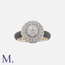 A Black And White Diamond Ring in 18k white gold, of cluster design, set with round cut white