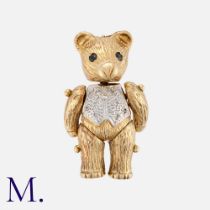 A Teddy Bear Pendant in 9K yellow and white gold with articulated head, arms and legs. Size: 3.2x1.