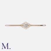 A Diamond Cluster Bar Brooch in yellow gold and platinum, set centrally with a cluster of round