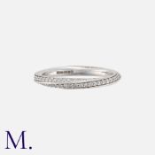 A Diamond Ring in 18k white gold, of twisted design, set with round cut diamonds totalling