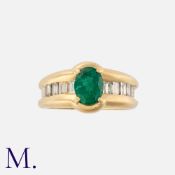 An Emerald and Diamond Ring in yellow gold, set with a forest green oval-cut emerald to the centre
