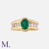An Emerald and Diamond Ring in yellow gold, set with a forest green oval-cut emerald to the centre