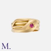 A Victorian Snake Ring in 18k yellow gold, designed as a coiled snake, set with a round cut ruby