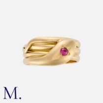 A Victorian Snake Ring in 18k yellow gold, designed as a coiled snake, set with a round cut ruby